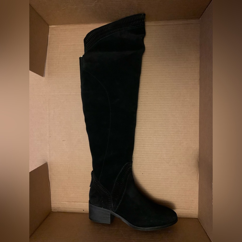 Black boots, knee high, small heel.